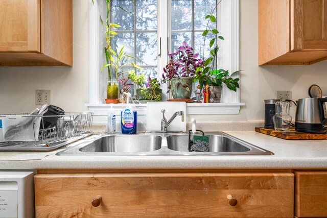 6 Winter St, Augusta, ME 04330 - kitchen featuring a sink, light countertops, and washer / dryer