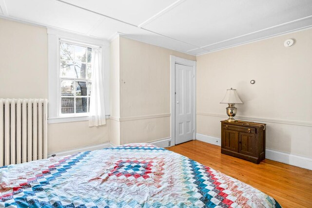 6 Winter St, Augusta, ME 04330 - bedroom featuring radiator, wood finished floors, and baseboards