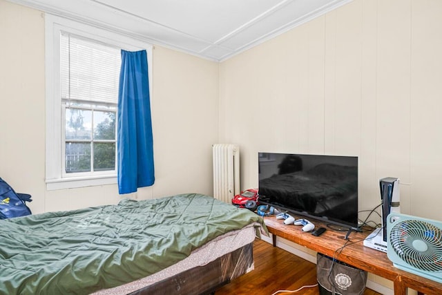 6 Winter St, Augusta, ME 04330 - bedroom featuring radiator, wood finished floors, and ornamental molding