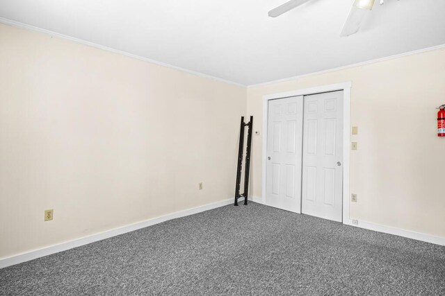 6 Winter St, Augusta, ME 04330 - unfurnished bedroom with carpet floors, crown molding, ceiling fan, baseboards, and a closet