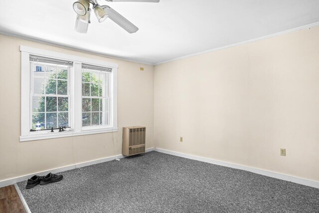 6 Winter St, Augusta, ME 04330 - empty room featuring heating unit, baseboards, a ceiling fan, crown molding, and carpet floors