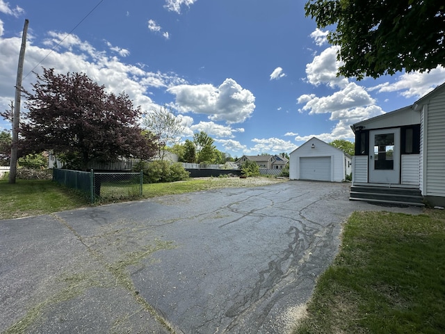52 Rideout Ave, Lewiston, ME 04240 - view of asphalt driveway with entry steps