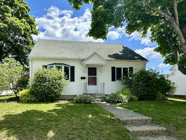 52 Rideout Ave, Lewiston, ME 04240 - view of front of property featuring a front lawn and roof with shingles