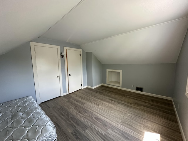 52 Rideout Ave, Lewiston, ME 04240 - additional living space featuring lofted ceiling, dark wood-type flooring, and baseboards