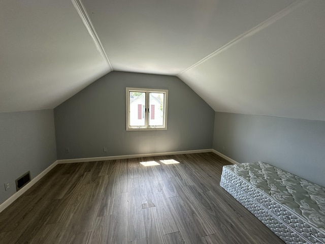 52 Rideout Ave, Lewiston, ME 04240 - bonus room with dark wood-style floors, lofted ceiling, and baseboards