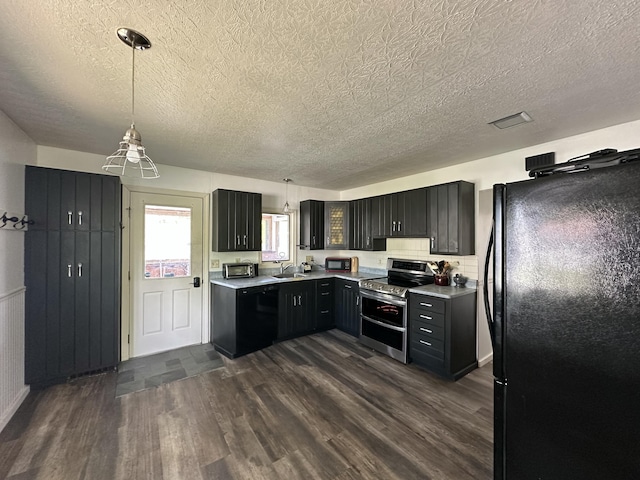 52 Rideout Ave, Lewiston, ME 04240 - kitchen featuring black appliances, light countertops, dark wood-type flooring, a sink, and pendant lighting