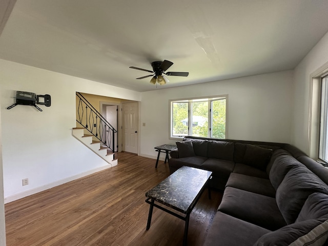 52 Rideout Ave, Lewiston, ME 04240 - living room featuring stairs, wood finished floors, baseboards, and ceiling fan
