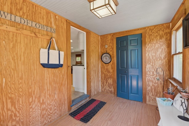 592 Old Stage Rd, Arrowsic, ME 04530 - entryway with wood finished floors, wood walls, and baseboards