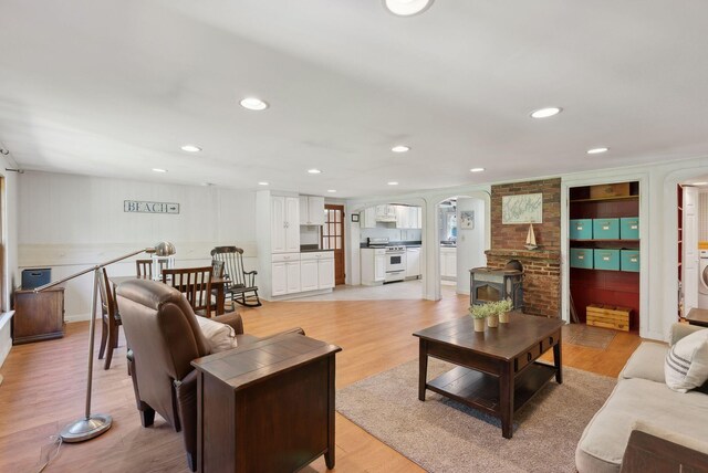 592 Old Stage Rd, Arrowsic, ME 04530 - living area with arched walkways, light wood-style flooring, and recessed lighting