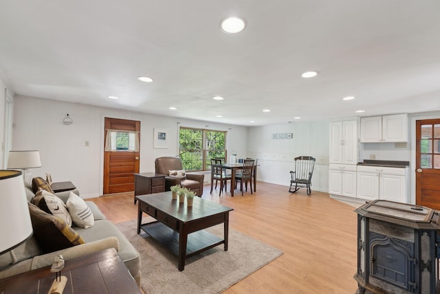 592 Old Stage Rd, Arrowsic, ME 04530 - living room with plenty of natural light, light wood finished floors, recessed lighting, and a wood stove