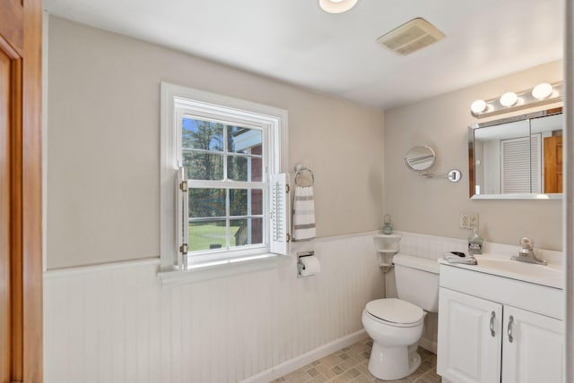 592 Old Stage Rd, Arrowsic, ME 04530 - bathroom with a wainscoted wall, vanity, and toilet