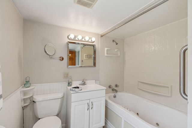 592 Old Stage Rd, Arrowsic, ME 04530 - bathroom with a combined bath / shower with jetted tub, vanity, toilet, and a wainscoted wall