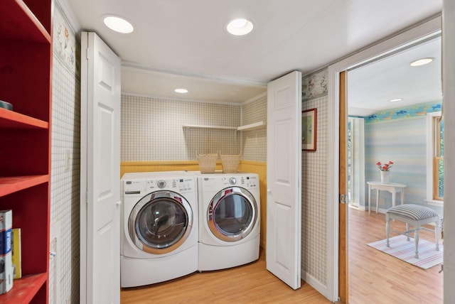 592 Old Stage Rd, Arrowsic, ME 04530 - laundry room with wallpapered walls, washing machine and clothes dryer, and light wood-type flooring
