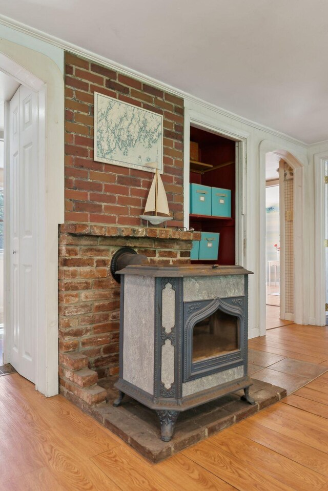 592 Old Stage Rd, Arrowsic, ME 04530 - detailed view of wood finished floors, crown molding, and arched walkways