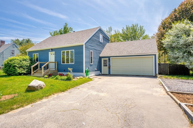 94 Thompson St, South Portland, ME 04106 - view of front of home with driveway, roof with shingles, and an attached garage