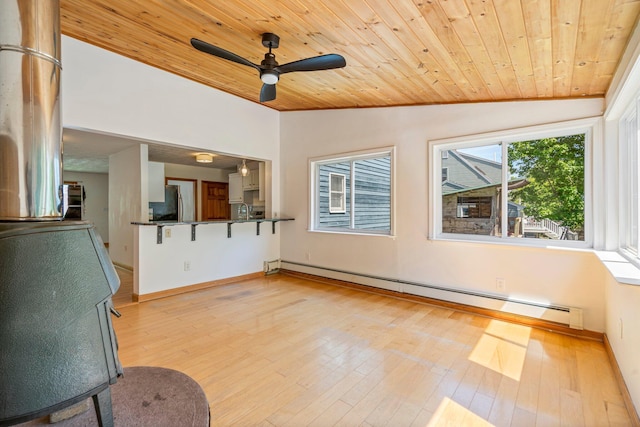 94 Thompson St, South Portland, ME 04106 - unfurnished living room with wood ceiling, vaulted ceiling, baseboard heating, ceiling fan, and light wood-type flooring