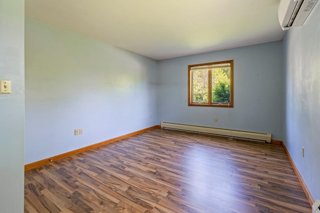 94 Thompson St, South Portland, ME 04106 - empty room with a wall mounted AC, baseboard heating, wood finished floors, and baseboards