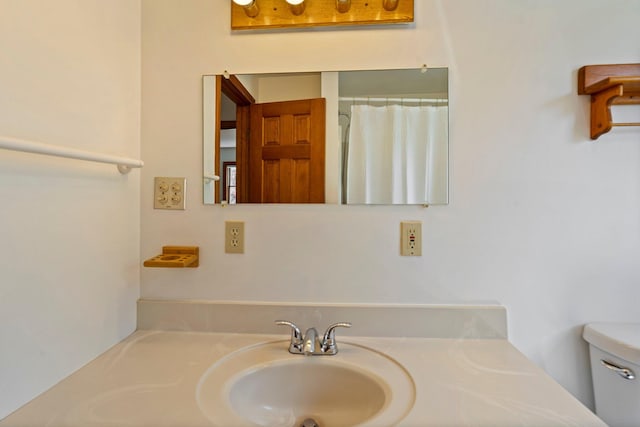 94 Thompson St, South Portland, ME 04106 - bathroom with toilet, vanity, and curtained shower