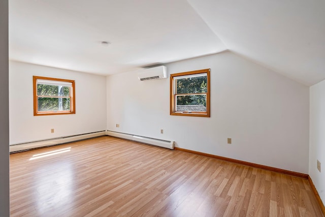 94 Thompson St, South Portland, ME 04106 - additional living space featuring a wall unit AC, plenty of natural light, light wood finished floors, baseboard heating, and vaulted ceiling