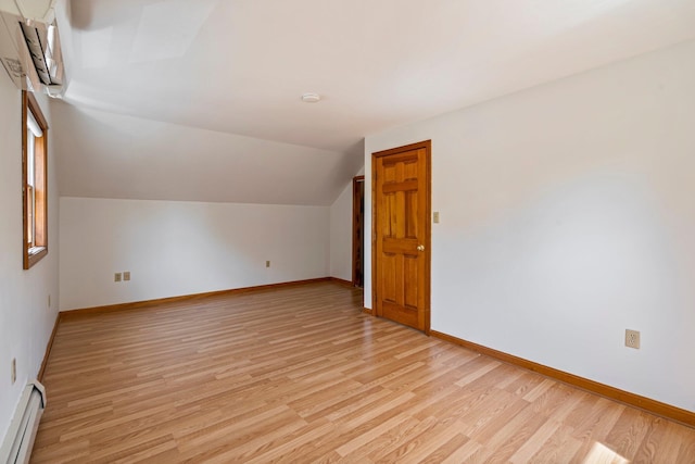 94 Thompson St, South Portland, ME 04106 - additional living space with a baseboard radiator, light wood-style flooring, baseboards, and vaulted ceiling