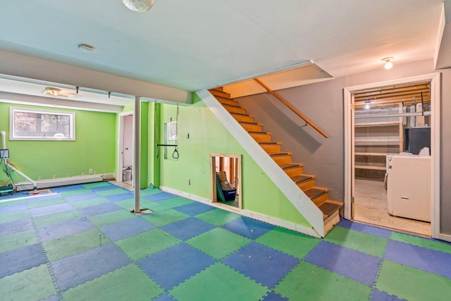 94 Thompson St, South Portland, ME 04106 - finished below grade area with tile patterned floors, washer / dryer, stairway, and baseboards