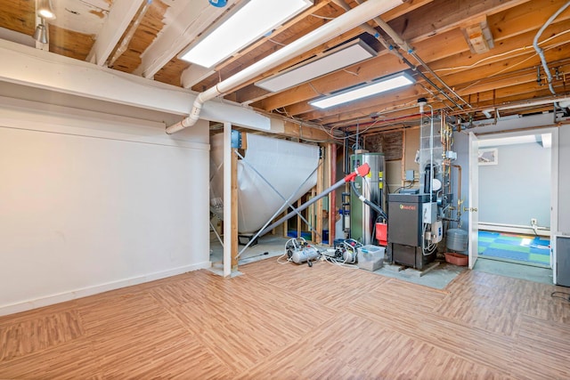 94 Thompson St, South Portland, ME 04106 - unfinished basement with a heating unit, gas water heater, and a baseboard radiator