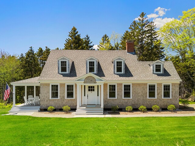 286 Atlantic Hwy, Northport, ME 04849 - view of front of property featuring a chimney, a front yard, and a shingled roof