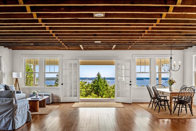 286 Atlantic Hwy, Northport, ME 04849 - foyer entrance featuring a chandelier, healthy amount of natural light, and hardwood / wood-style flooring