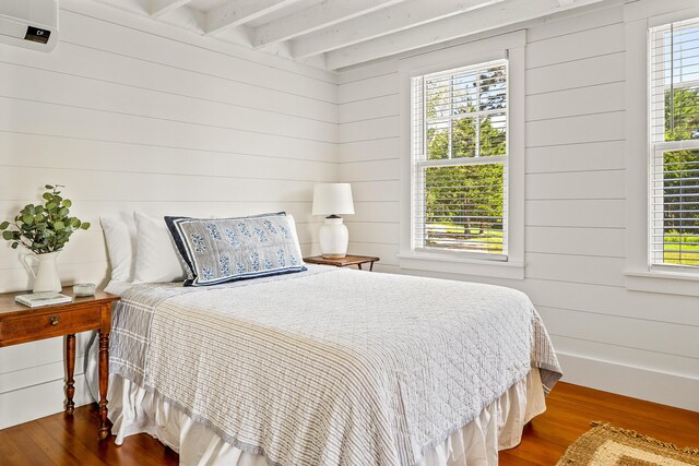 286 Atlantic Hwy, Northport, ME 04849 - bedroom featuring dark wood-style flooring, beamed ceiling, and wooden walls