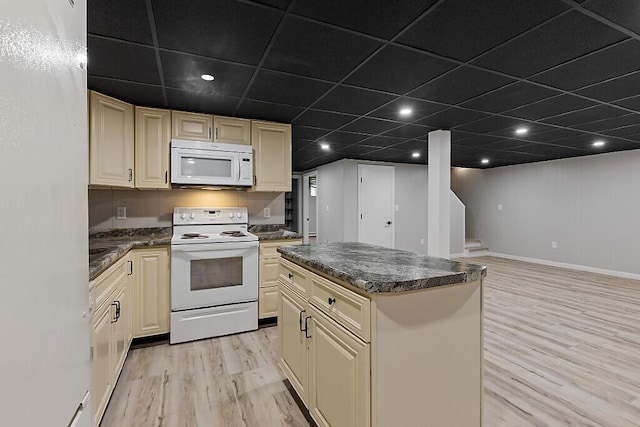 7 Philip Ave, Augusta, ME 04330 - kitchen featuring white appliances, cream cabinets, light wood-style flooring, dark countertops, and a drop ceiling