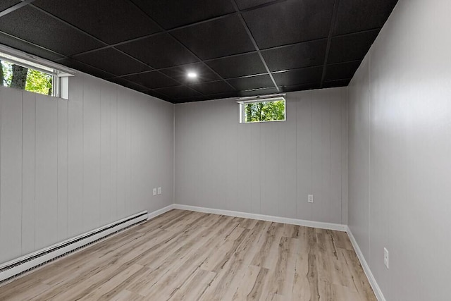 7 Philip Ave, Augusta, ME 04330 - empty room featuring a baseboard heating unit, wood finished floors, healthy amount of natural light, and baseboards