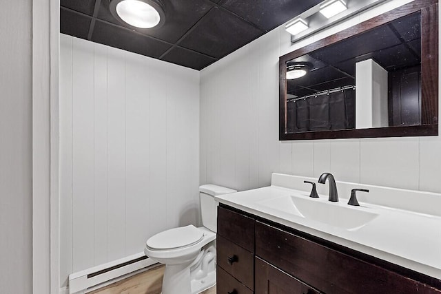 7 Philip Ave, Augusta, ME 04330 - bathroom with baseboard heating, vanity, toilet, wood finished floors, and a shower with shower curtain