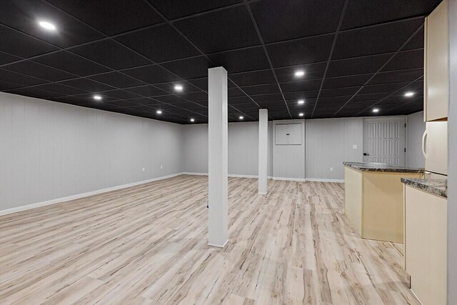 7 Philip Ave, Augusta, ME 04330 - finished basement with light wood-style flooring, freestanding refrigerator, and baseboards