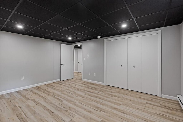 7 Philip Ave, Augusta, ME 04330 - finished basement with wood finished floors, baseboards, recessed lighting, a baseboard heating unit, and a paneled ceiling