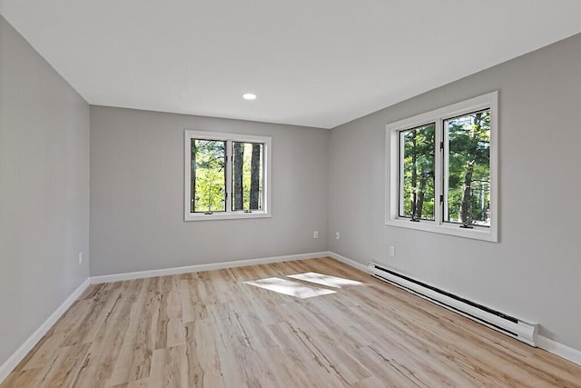 7 Philip Ave, Augusta, ME 04330 - spare room with a baseboard radiator, baseboards, wood finished floors, and recessed lighting