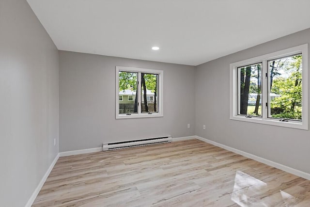 7 Philip Ave, Augusta, ME 04330 - empty room featuring a baseboard radiator, wood finished floors, baseboards, and recessed lighting