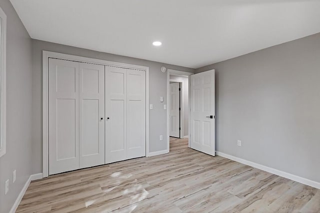 7 Philip Ave, Augusta, ME 04330 - unfurnished bedroom featuring light wood finished floors, baseboards, recessed lighting, and a closet