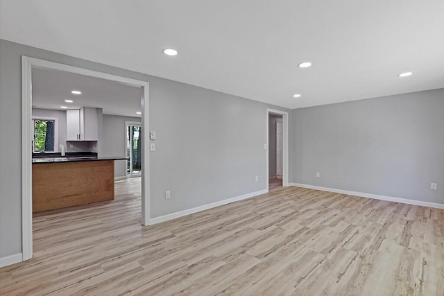 7 Philip Ave, Augusta, ME 04330 - unfurnished living room featuring light wood finished floors, baseboards, and recessed lighting