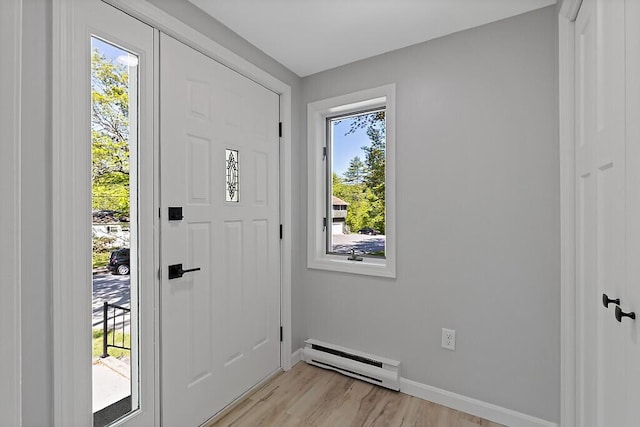 7 Philip Ave, Augusta, ME 04330 - foyer with baseboard heating, baseboards, and light wood-style floors