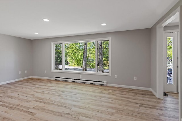 7 Philip Ave, Augusta, ME 04330 - empty room featuring baseboard heating, plenty of natural light, light wood-style flooring, baseboards, and recessed lighting