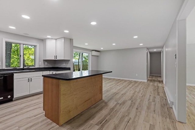 7 Philip Ave, Augusta, ME 04330 - kitchen with dishwasher, a sink, dark countertops, white cabinets, and a kitchen island