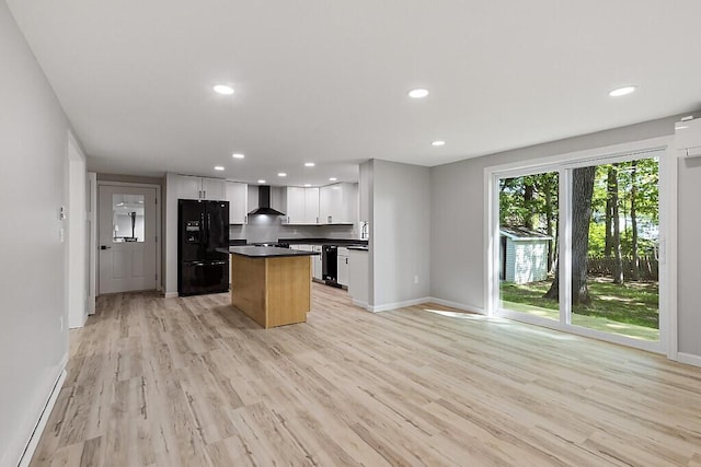 7 Philip Ave, Augusta, ME 04330 - kitchen with black appliances, wall chimney range hood, dark countertops, a kitchen island, and recessed lighting