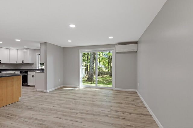 7 Philip Ave, Augusta, ME 04330 - kitchen featuring dark countertops, recessed lighting, light wood-type flooring, white cabinets, and baseboards