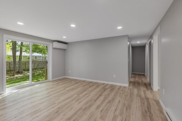 7 Philip Ave, Augusta, ME 04330 - spare room featuring a wall unit AC, light wood-type flooring, baseboards, recessed lighting, and baseboard heating