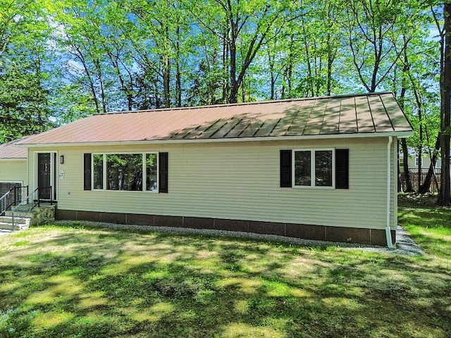 7 Philip Ave, Augusta, ME 04330 - view of front of home featuring a standing seam roof, metal roof, and a front yard