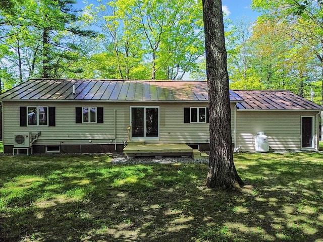 7 Philip Ave, Augusta, ME 04330 - rear view of property with a standing seam roof, metal roof, a yard, and a deck