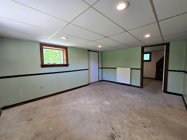 237 Bangor Rd, Unity, ME 04988 - below grade area featuring baseboards, a drop ceiling, recessed lighting, and radiator heating unit