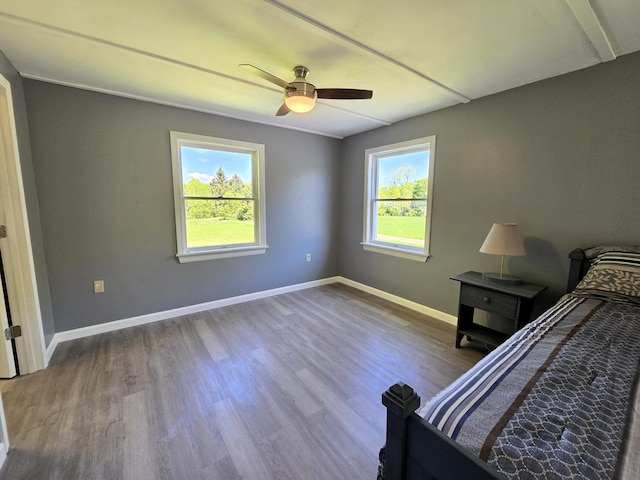 237 Bangor Rd, Unity, ME 04988 - unfurnished bedroom featuring baseboards, wood finished floors, and ceiling fan