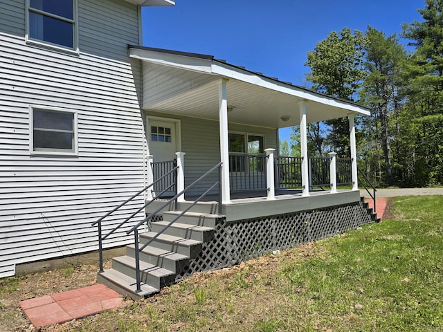 237 Bangor Rd, Unity, ME 04988 - view of exterior entry with a porch and a yard