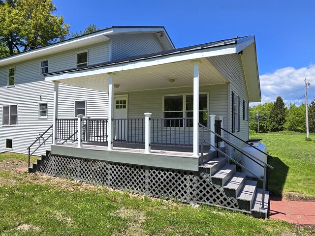237 Bangor Rd, Unity, ME 04988 - rear view of house with a lawn and stairs